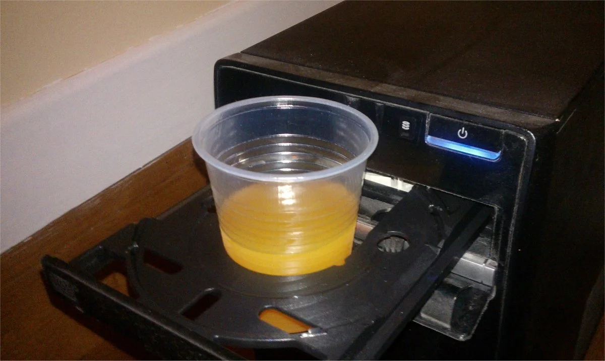 Cd_reader_used_as_a_cup_holder.webp