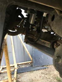 Left Lower Control Arm with Compressed Spring.webp