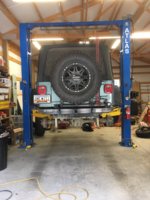 Jeep on lift to begin upgrade.jpg